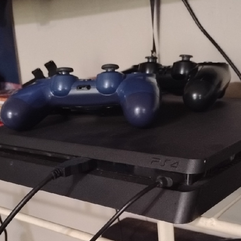 Sony PS4 Console with Black and Blue Controllers